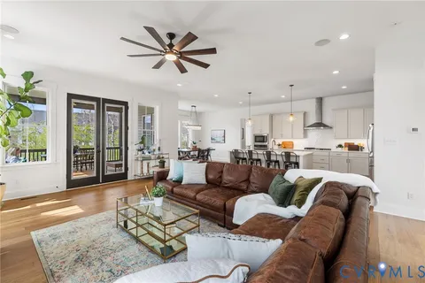 a bedroom with a bed and a potted plant