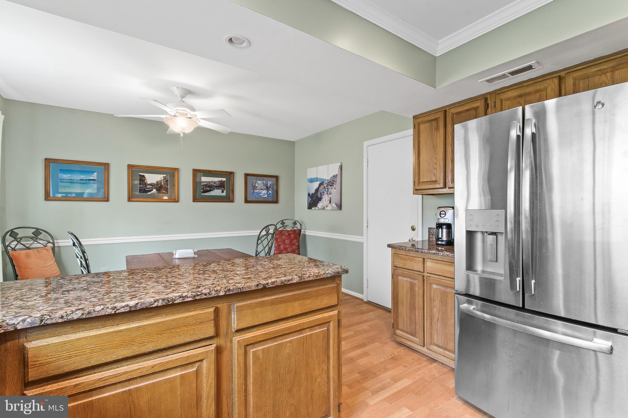 13813 Turnmore Road Silver Spring, MD 20906 - Photo 18 of 38 Kitchen Open To Breakfast Area w/Pergo Flooring