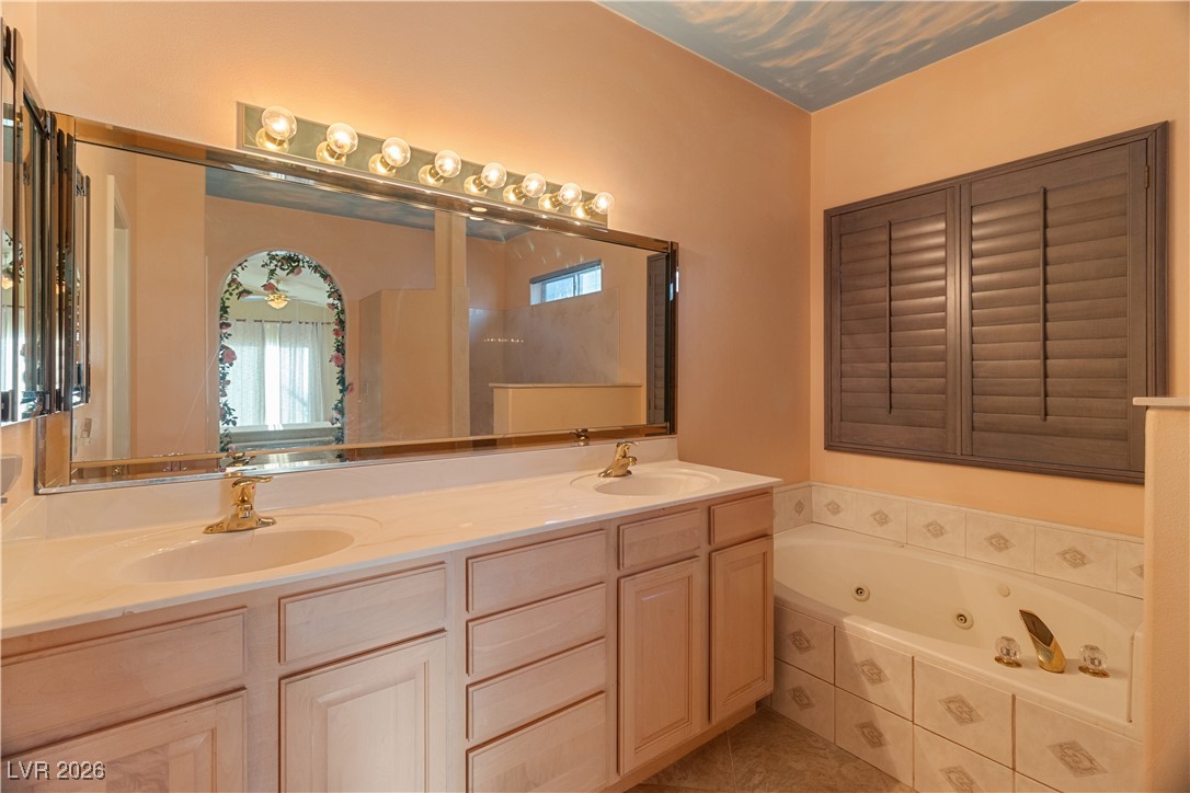 1210 Country Club Drive Laughlin, NV 89029 - Photo 22 of 80 Full Primary bathroom featuring double vanity and a jetted tub