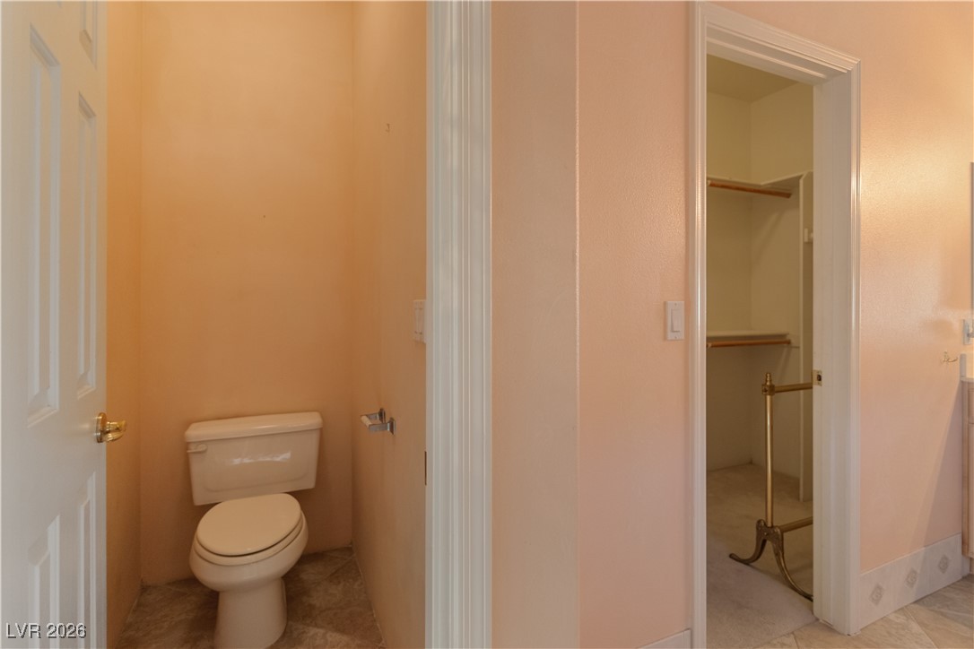 1210 Country Club Drive Laughlin, NV 89029 - Photo 25 of 80 Primary Bathroom featuring water closet and walk-in closet