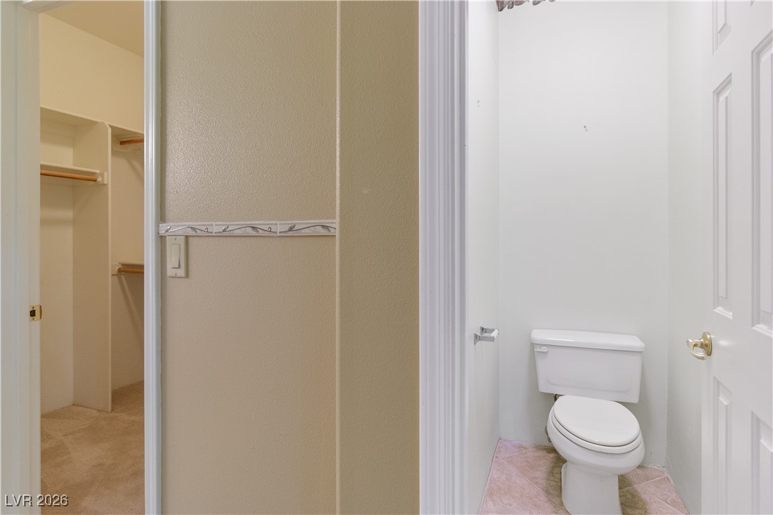 1210 Country Club Drive Laughlin, NV 89029 - Photo 34 of 80 Ensuite Secondary Bathroom featuring a walk-in closet and water closet