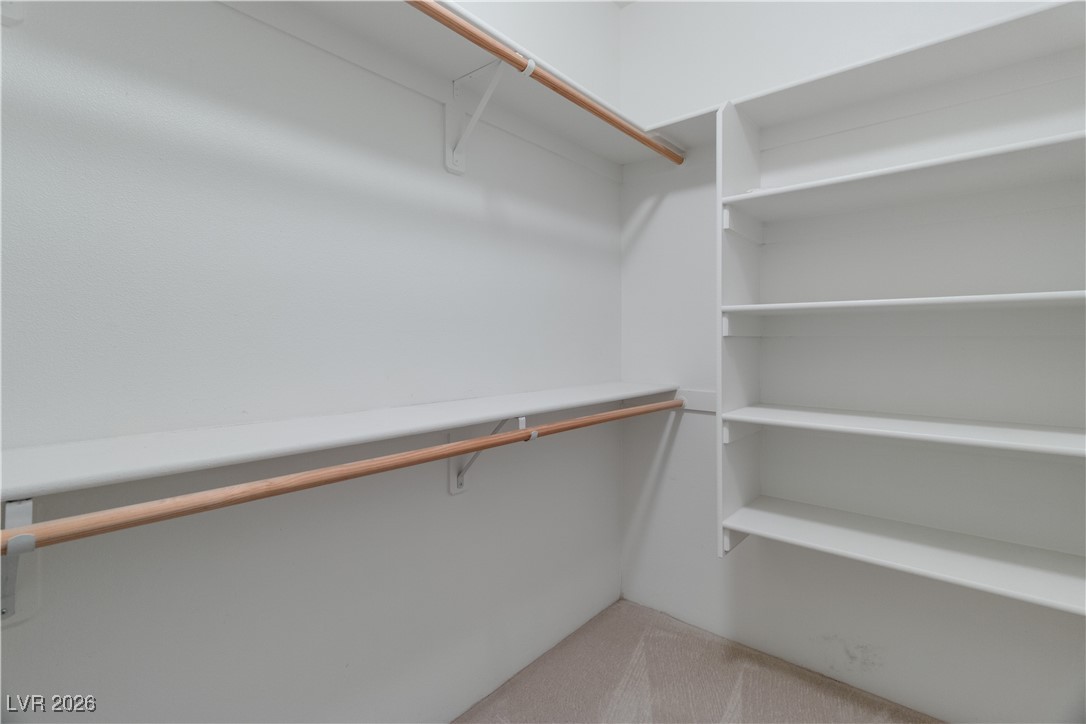 1210 Country Club Drive Laughlin, NV 89029 - Photo 36 of 80 Spacious walk-in closet featuring light carpet and built-in shelving