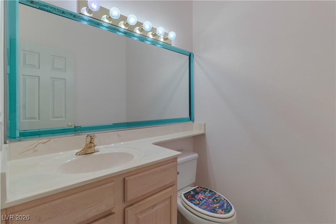 1210 Country Club Drive Laughlin, NV 89029 - Photo 38 of 80 Hallway Half bathroom with vanity and toilet