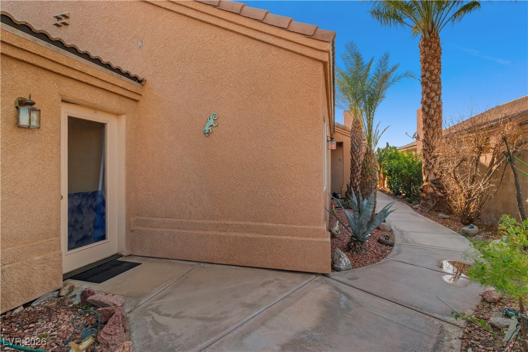 1210 Country Club Drive Laughlin, NV 89029 - Photo 42 of 80 Front walkway to home' front door entry, pictured here is the door to the 3rd bedroom which has exterior access, walking past this door leads to the front door, in the next photo