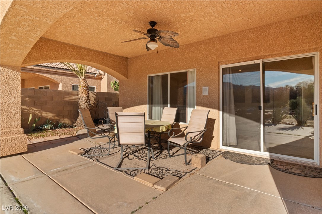1210 Country Club Drive Laughlin, NV 89029 - Photo 48 of 80 View of back covered patio with a ceiling fan and outdoor dining area