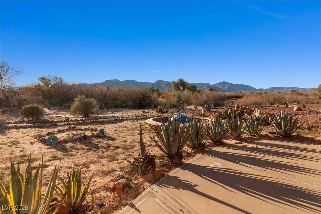 1210 Country Club Drive Laughlin, NV 89029 - Photo 53 of 80 View of backyard with mountain backdrop