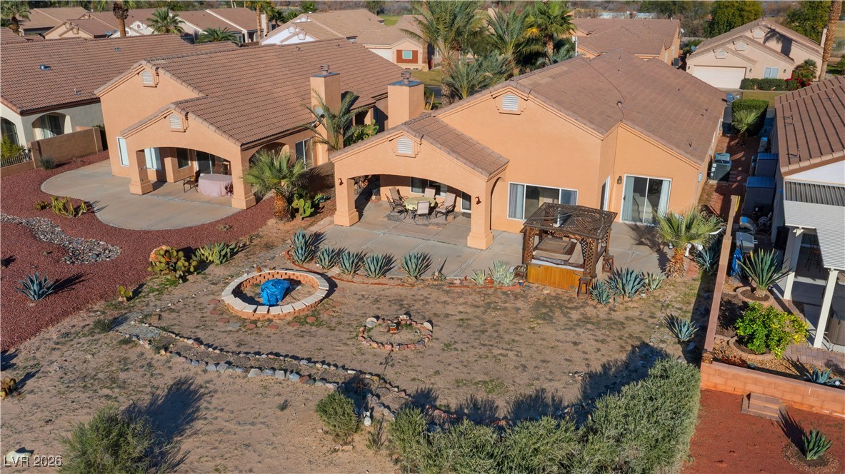 1210 Country Club Drive Laughlin, NV 89029 - Photo 65 of 80 Aerial view of the back of the home, with covered patio and yard