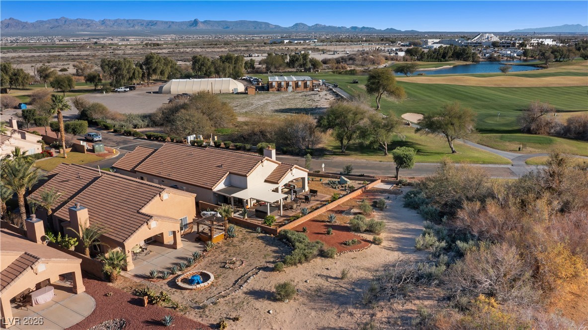 1210 Country Club Drive Laughlin, NV 89029 - Photo 68 of 80 Drone / aerial view of the home on a golf course and a water and mountain view
