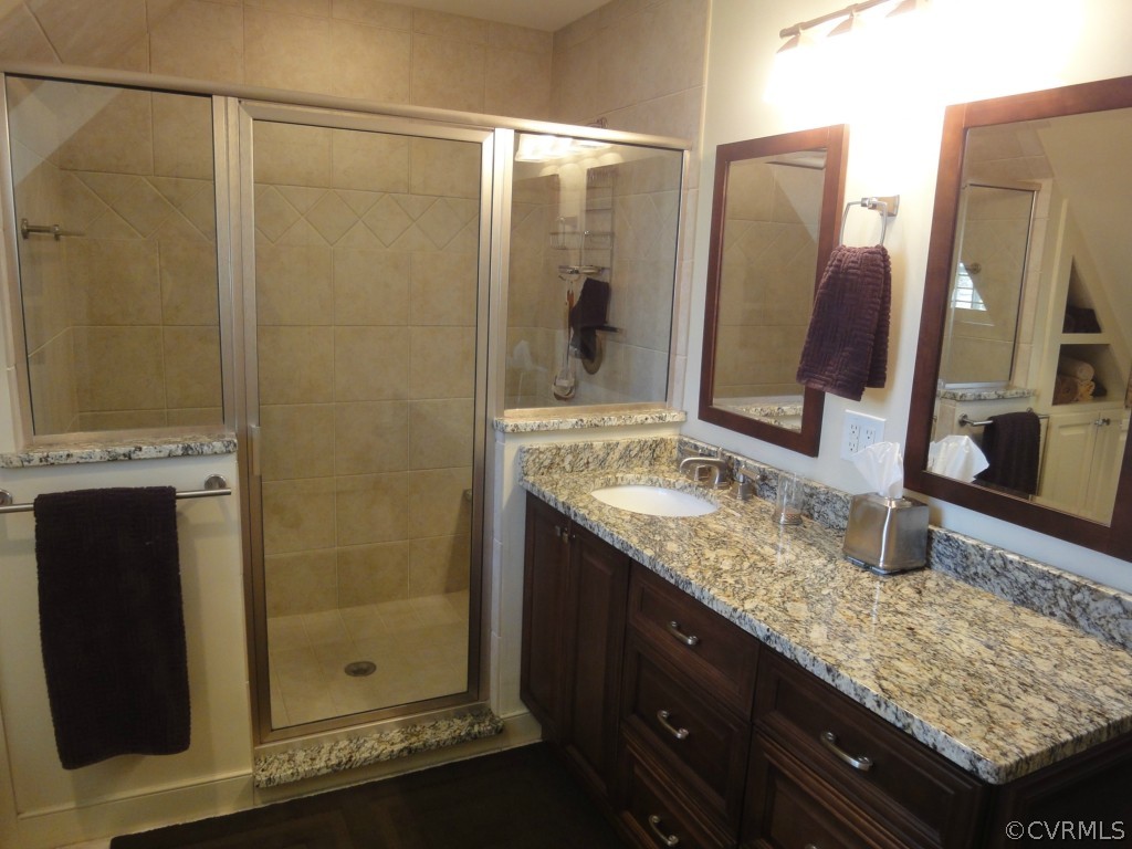 2716 East Brigstock Road Midlothian, VA 23113 - Photo 12 of 24 a bathroom with a granite countertop sink and a mirror