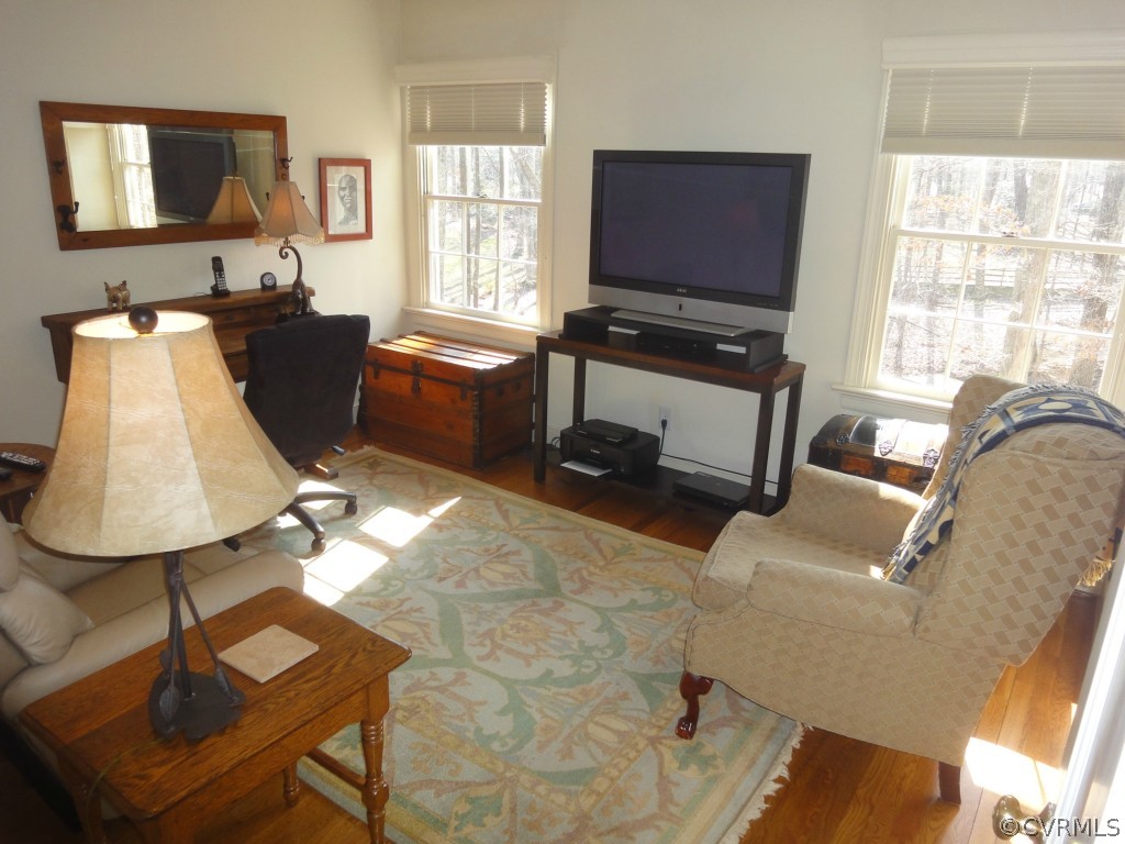 2716 East Brigstock Road Midlothian, VA 23113 - Photo 15 of 24 a living room with furniture a flat screen tv and a window