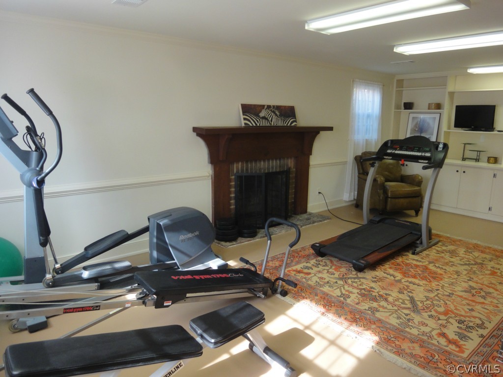 2716 East Brigstock Road Midlothian, VA 23113 - Photo 18 of 24 a living room with furniture and a fireplace