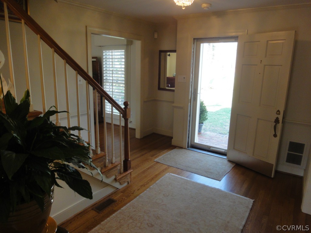 2716 East Brigstock Road Midlothian, VA 23113 - Photo 2 of 24 a view of an entryway with wooden floor and stairs