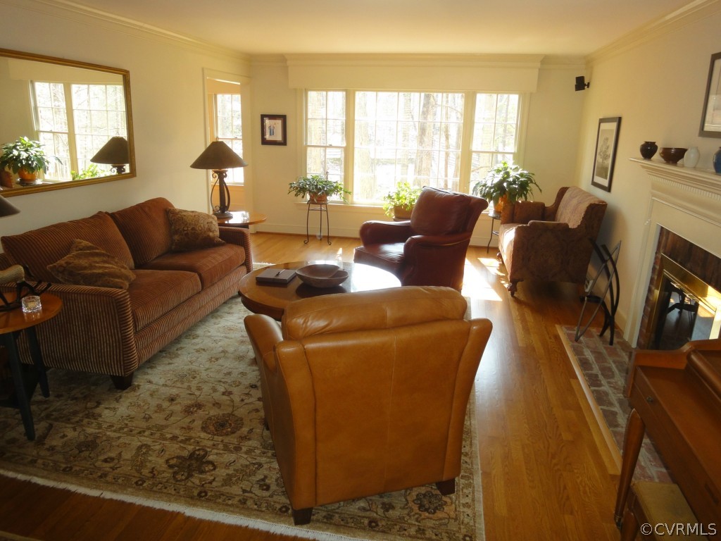 2716 East Brigstock Road Midlothian, VA 23113 - Photo 4 of 24 a living room with furniture and a fireplace