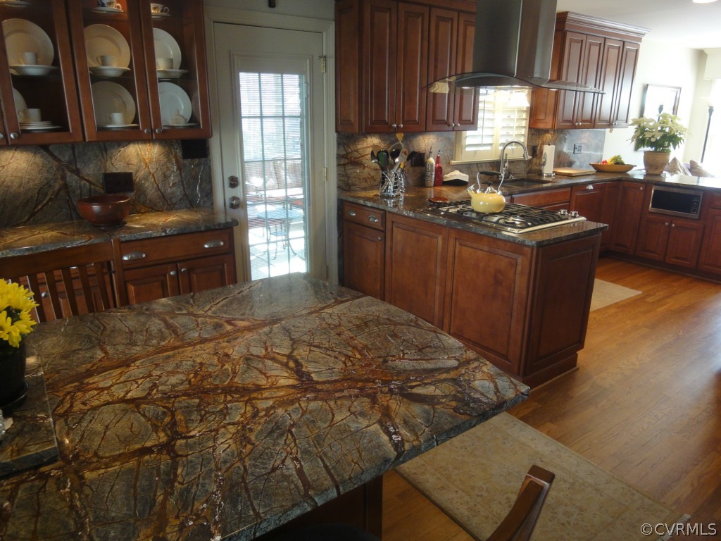 2716 East Brigstock Road Midlothian, VA 23113 - Photo 6 of 24 a kitchen with wooden cabinets and a sink