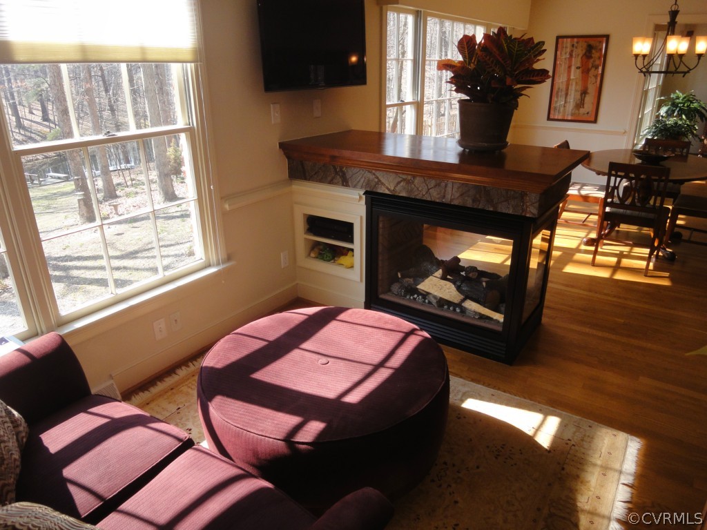 2716 East Brigstock Road Midlothian, VA 23113 - Photo 9 of 24 a living room with furniture and a fireplace