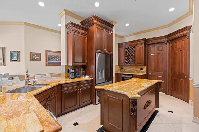 a kitchen with a sink stove and refrigerator