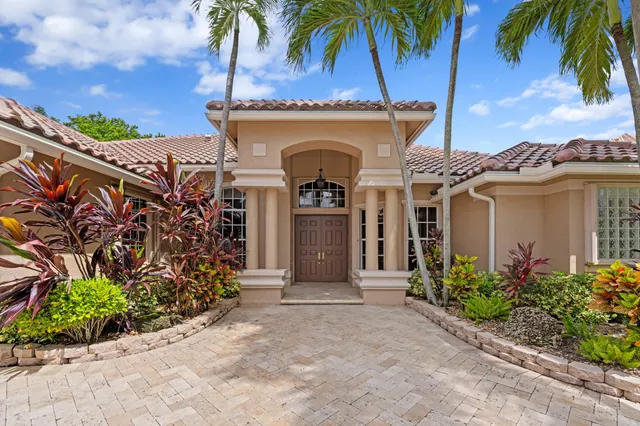 front view of a house with a garden