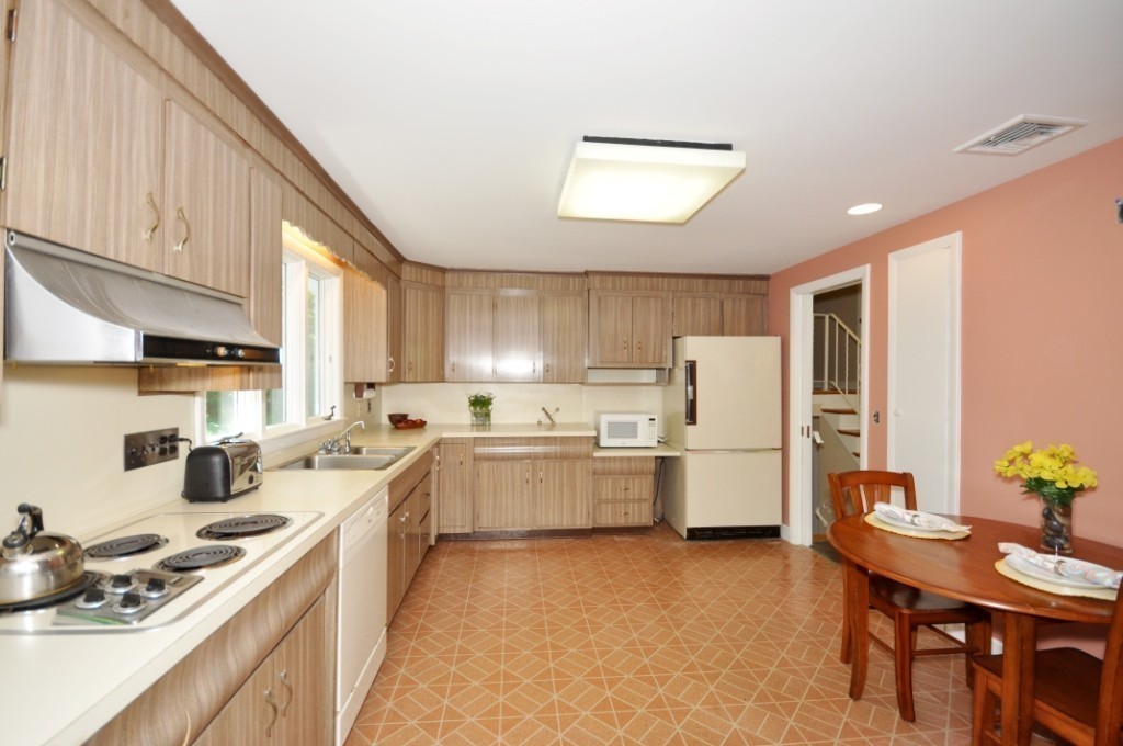 23 Peachtree Road Lexington, MA 02420 - Photo 12 of 30 a kitchen with a sink stove and refrigerator