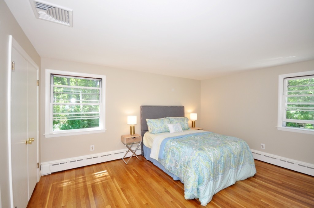 23 Peachtree Road Lexington, MA 02420 - Photo 15 of 30 a bedroom with a bed and window