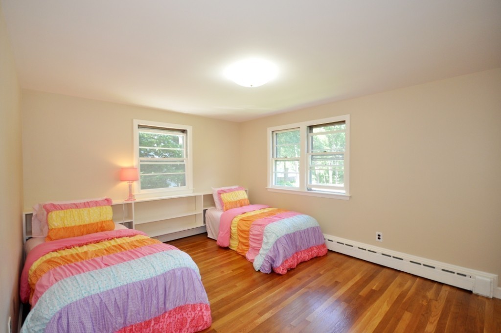 23 Peachtree Road Lexington, MA 02420 - Photo 18 of 30 a bedroom with two beds and a window