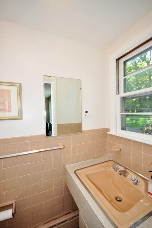 23 Peachtree Road Lexington, MA 02420 - Photo 21 of 30 a bathroom with a tub a sink and a window