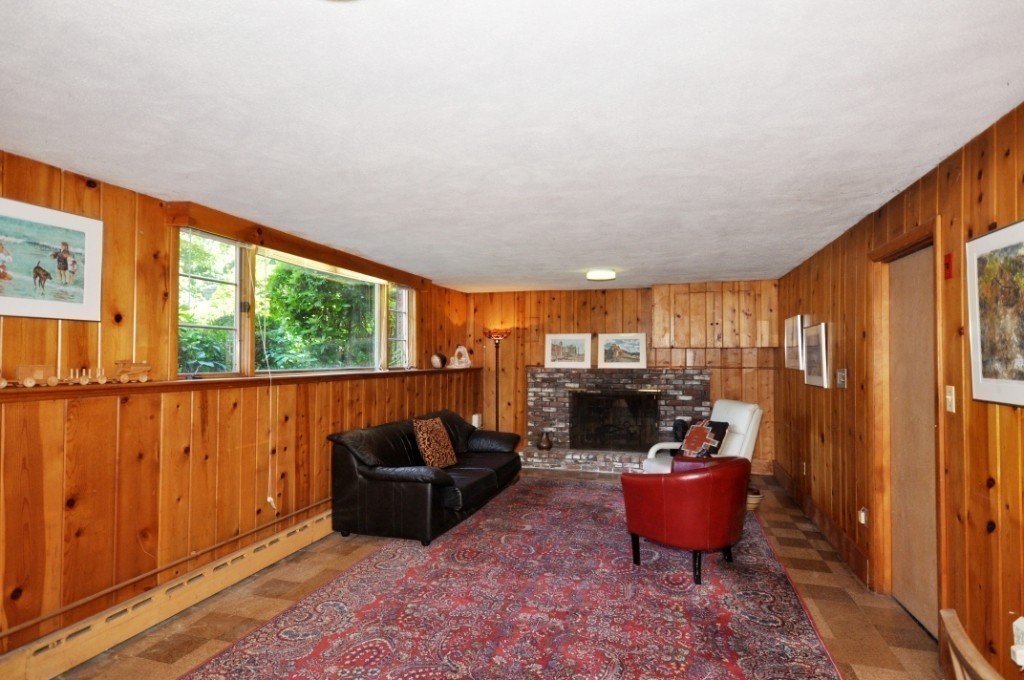 23 Peachtree Road Lexington, MA 02420 - Photo 23 of 30 a living room with furniture a flat screen tv and a large window