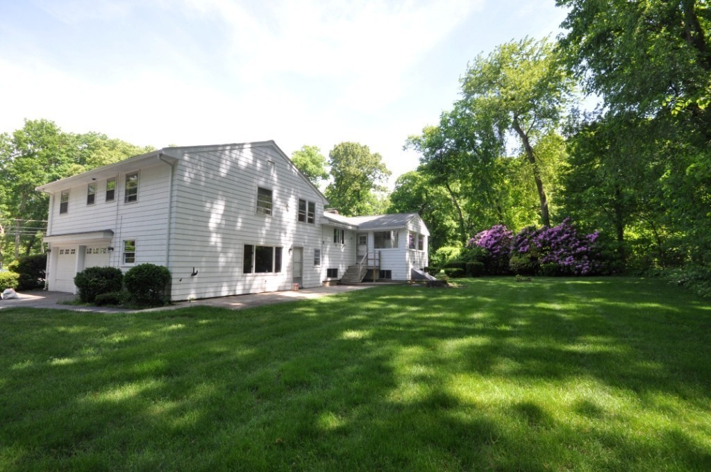 23 Peachtree Road Lexington, MA 02420 - Photo 25 of 30 a front view of house with yard and green space