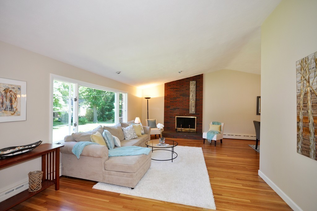 23 Peachtree Road Lexington, MA 02420 - Photo 6 of 30 a living room with furniture and a fireplace