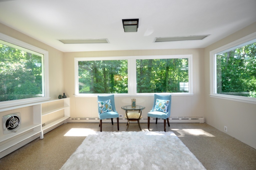 23 Peachtree Road Lexington, MA 02420 - Photo 9 of 30 a living room with furniture and large windows