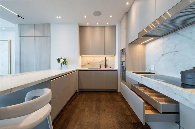 a table with a vase and flowers on it