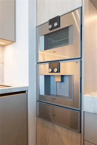 a bathroom with a granite countertop sink toilet a mirror and shower