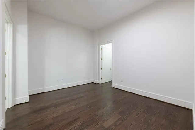 a view of a swimming pool and a back yard