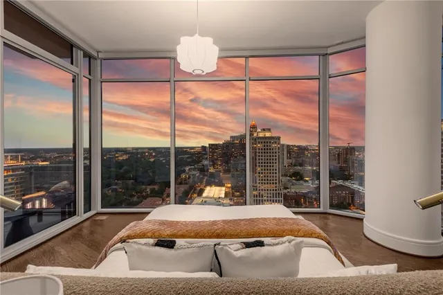 a kitchen with stainless steel appliances kitchen island granite countertop a refrigerator and microwave