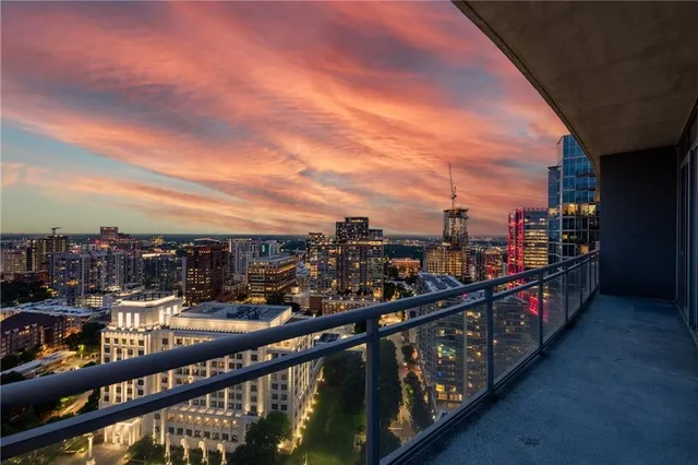 a living room with furniture potted plant and a large mirror
