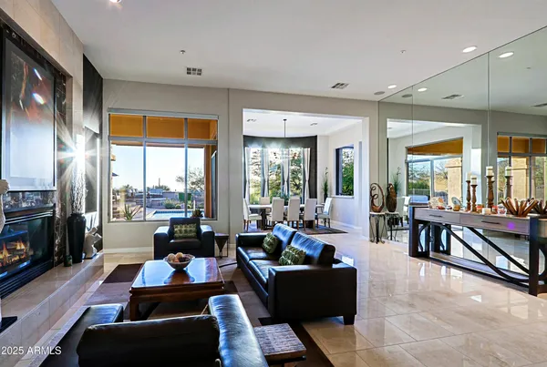 a kitchen with stainless steel appliances kitchen island granite countertop a refrigerator and a stove top oven