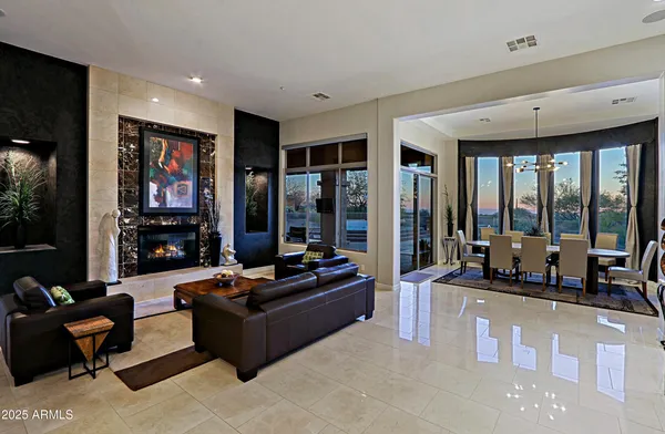 a livingroom with furniture and a flat screen tv