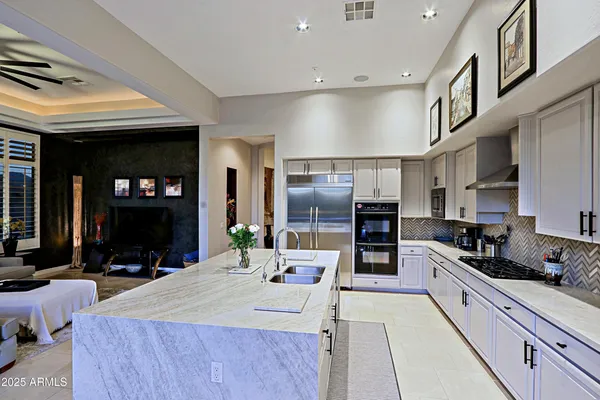 a view of a bathroom with a sink and mirror