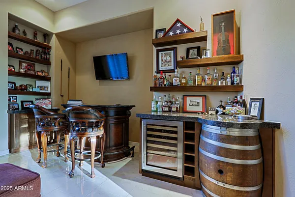 a view of a swimming pool with an outdoor seating and a garden