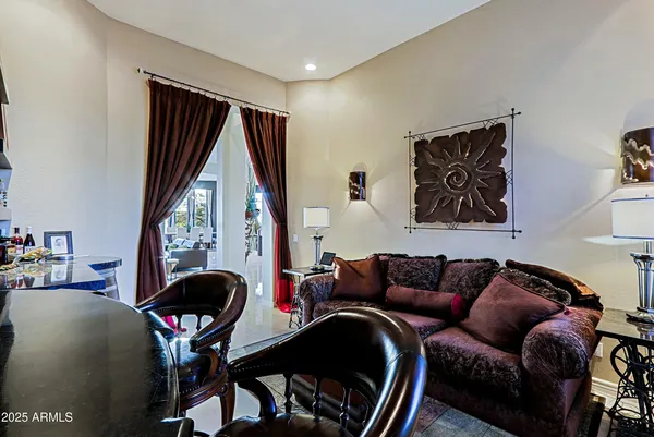 a front view of a house with swimming pool having outdoor seating