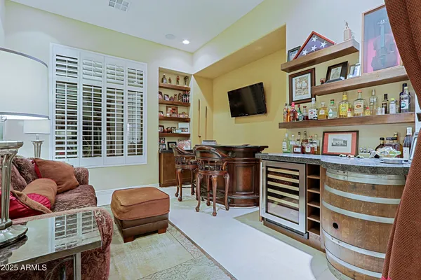 a view of a house with swimming pool and sitting area