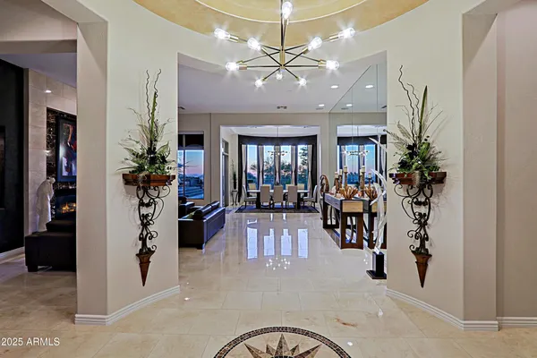 a view of a livingroom with furniture and a chandelier