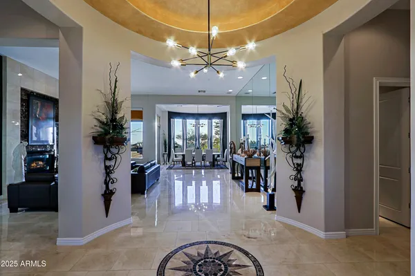 a kitchen with kitchen island a counter top a stove a sink and cabinets