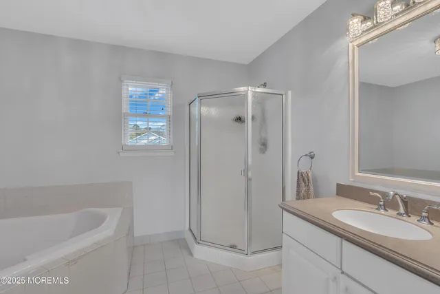 a bathroom with a granite countertop sink a toilet and bathtub