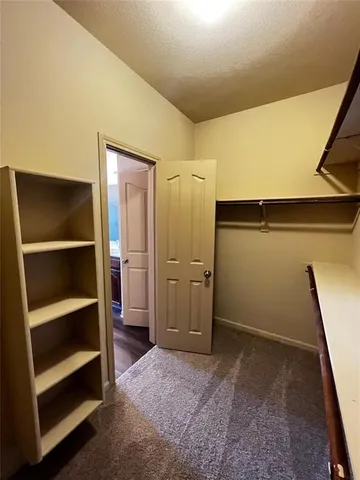 a bathroom with double vanity and mirrors