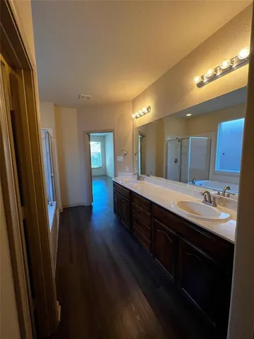 a bathroom with a bathtub and a shower