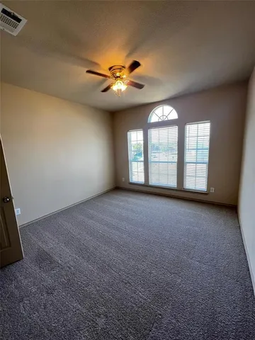 a view of a hallway to rooms