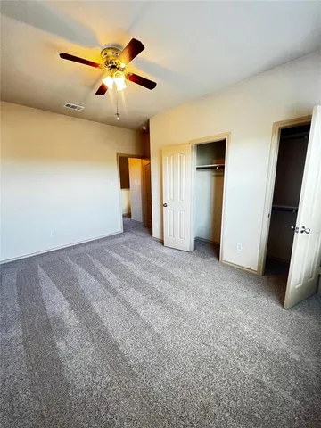 a bathroom with a double vanity sink toilet and shower