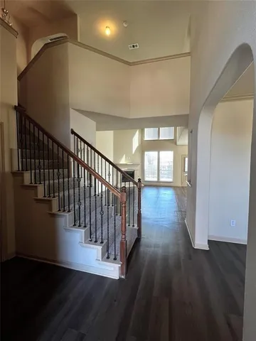 a view of gallery with wooden floor