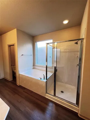 a bathroom with a shower and mirror
