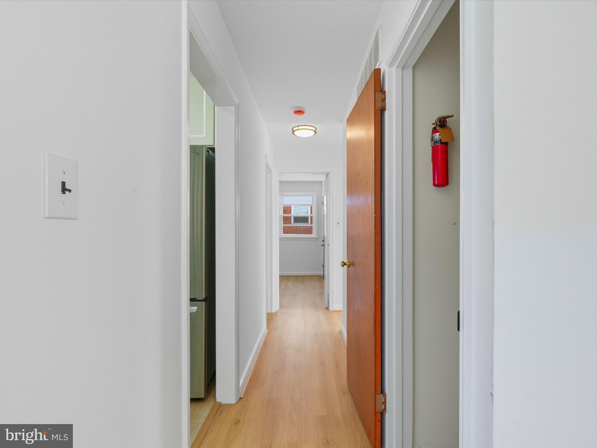 12907 Matey Road Silver Spring, MD 20906 - Photo 15 of 45 a view of a hallway with wooden floor